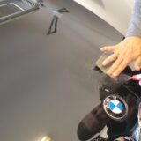 BMW with a Shiny Hood: Showcasing Detailing Cost Factors that contribute to its stunning appearance.